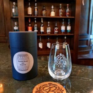 glass tumbler on a bar with Boleskine House branding